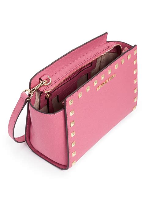 michael kors pink studded purse.